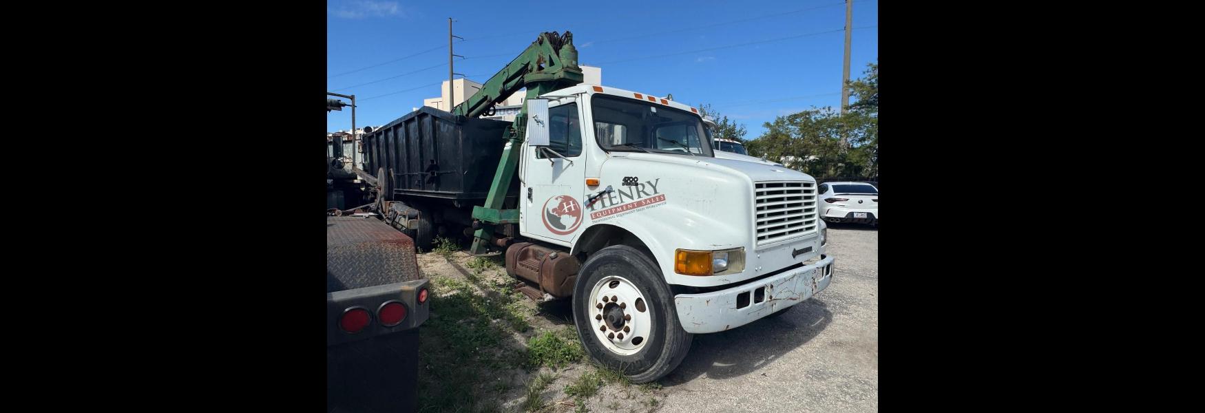 Henry Equipment Sales - 2000 International 4700 Grapple Truck